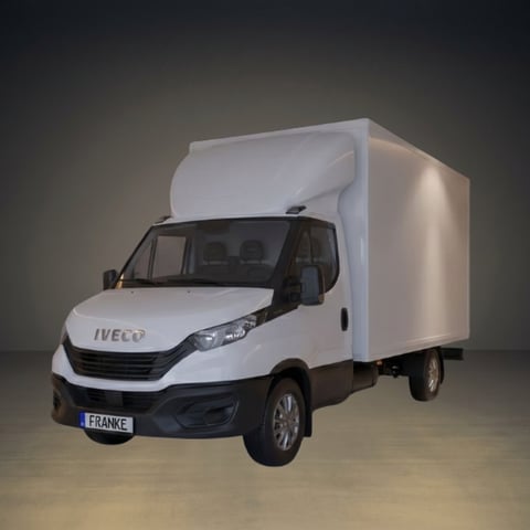 White IVECO delivery truck with large cargo box photographed against a neutral gradient background