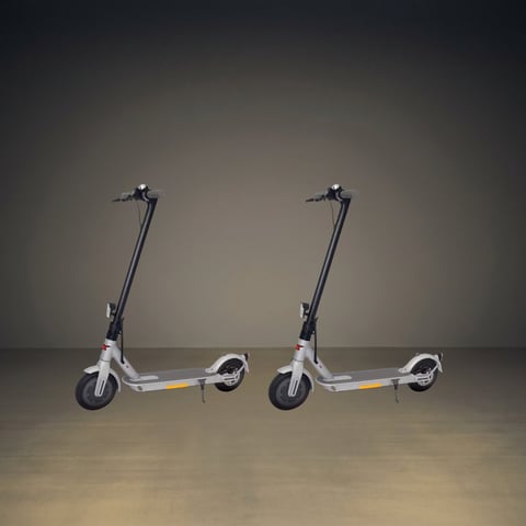 Two white and black electric scooters with extended handlebar stems displayed side by side against a neutral gray background.