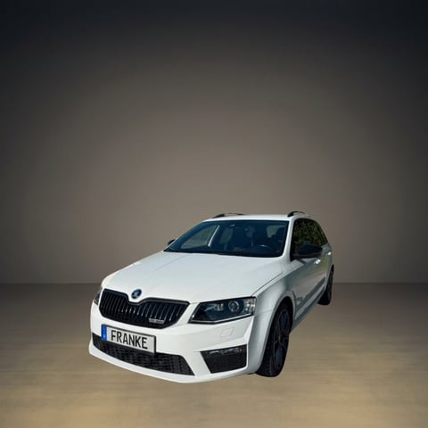 White Skoda car with FRANKE license plate on neutral gray background in studio setting