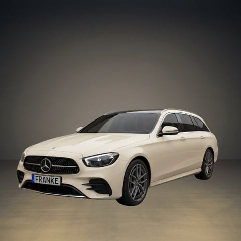 White Mercedes-Benz E-Class wagon displayed against a neutral gray background